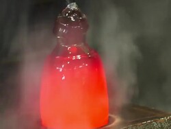 Glass Maker Forming Hot Glass In A Big Wood Block Stock Footage