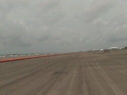 Beach Closed sign, orange oil containment boom on beach Stock Footage