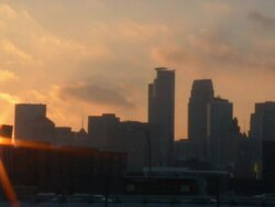 MS Sun setting behind Minneapolis skyline / Minneapolis, Minnesota, United States Stock Footage