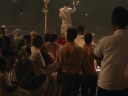 WS Men carrying out oil lamps for Aarti Puja ceremony / Varanasi, India Stock Footage