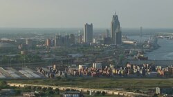 Shipping cranes  with Mobile, Alabama skyline in afternoon. Stock Footage