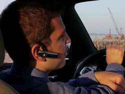 MS Man talking on bluetooth in car / Portland, ME, United States Stock Footage