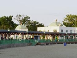 Boardwalk on the beach of Rye Playland in New York with railing and beach house in Deco style Stock Footage