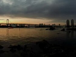 WS PAN T/L View of Rainbow bridge and Tokyo Bay at dusk / Odaiba, Tokyo, Japan  Stock Footage