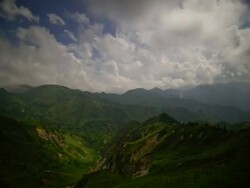T/L clouds moving over green valley in the Shiga mountains, Japan Stock Footage