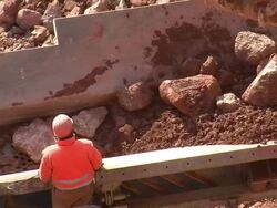 MS Man standing on chrushing machine at quarry / Taben-Rodt, Rhineland-Palatinate, Germany Stock Footage