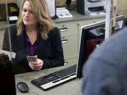 Man depositing cash in bank Stock Footage