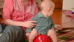 baby sitting on a children's pot Stock Footage