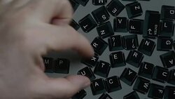 Computer keyboard fridge magnets spelling computer literacy Stock Footage