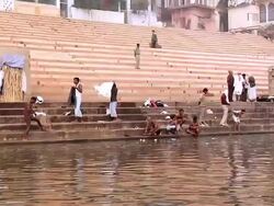 MS POV People bathing at pilgrims near Ganges River / Varanasi, Uttar Pradesh, India Stock Footage