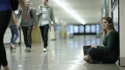 Young adult females bullying another student at school Stock Footage