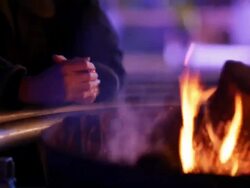 homeless man warming up Stock Footage