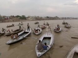 WS POV TS Men rowing boats ganga river / Varanasi, Uttar Pradesh, India Stock Footage