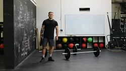 Confident muscular man holding weight in gym Stock Footage