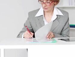 Businesswoman Signing a Document Stock Footage