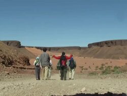 WS Group and nomad crossing desert / Atar, ADRAR, Mauritania Stock Footage