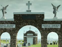 Entrance of a cemetery with a monument with statue Stock Footage