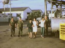 Vietnamese women on US base camp during Vietnam War Stock Footage