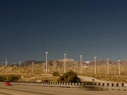T/L, WS, Wind turbines in desert landscape, Interstate 10 in foreground, Coachella Valley, North Palm Springs, California, USA Stock Footage