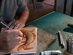 leatherworker paint  fish pattern on leather Stock Footage