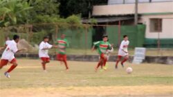 Young Brazilian soccer player dribbles ball through opposing team's defense and looks for open pass Stock Footage