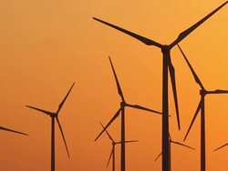 Eight Wind Turbines Orange Sky With Jet Stock Footage