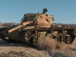 WS Broken down tank in the desert Stock Footage