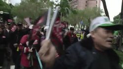 Tens of thousands protest against president's policies and position on China News Clip