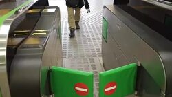 Pedestrians going trough gates Stock Footage