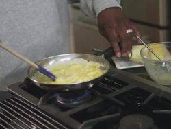 MS TD Dad cooking egg in kitchen / Dallas, Texas, USA Stock Footage