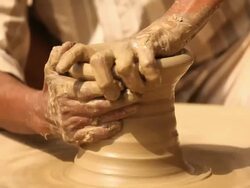 Man making a earthen pot on a pottery wheel, Faridabad, Haryana, India Stock Footage
