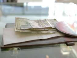 Dolly shot of banknotes on the cashier counter Stock Footage