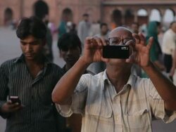 MH Man Talking Photo with Smart Phone in front of Jama Masjid Mosque / India Stock Footage