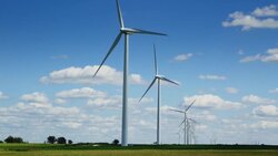 Tracking shot of Windfarm. Summer. Stock Footage