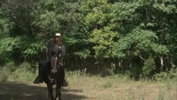 Confederate General Jeb Stuart rides his horse through a clearing. Stock Footage