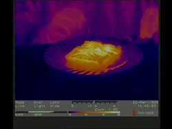 Thermographic image, CU hot pie on plate being eaten Stock Footage