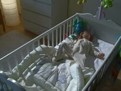 HD CRANE: Sleepless Baby Crying In Her Bed Stock Footage