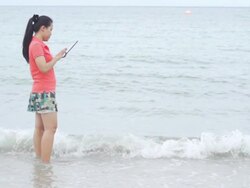 Using Tablet on the Beaches (Super Slow Motion) Stock Footage
