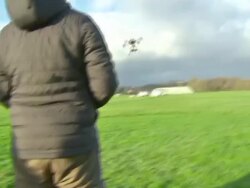 Remote-controlled camera drone being operated News Clip