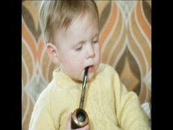 SYND 25/06/71 17 MONTH OLD CHILD SMOKES A PIPE Instructional Video