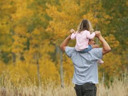 father and daughter walking through the woods Stock Footage