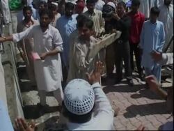 AP pix of Red Mosque beseiged by former seminary students, prayers News Clip