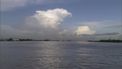 Clouds drift above a flooded Louisiana coastal area after Hurricane Katrina. Stock Footage