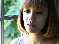 Woman on the verge of tears by a window Stock Footage