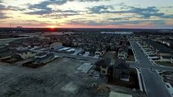 Dramatic Sky Sunset at Construction Site Suburban Houses being built Stock Footage