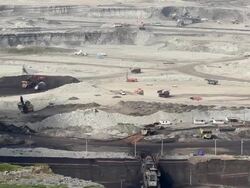 Time lapse Large Truck loading coal mine to automatic conveyor Stock Footage