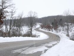 WS Husband and wife ridding on motorcycle with sidecar in rural area during winter / Osceola, Wisconsin, United States Stock Footage