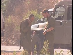 Tanks back from SLeb, Isr troops display captured Hezbollah flag, return News Clip