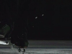 Close Up, Locked Down - The blade of a figure skater toe picks, jumps and spins off the ice / USA Stock Footage