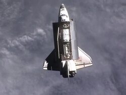 View of Space Shuttle Atlantis over the Earth Stock Footage